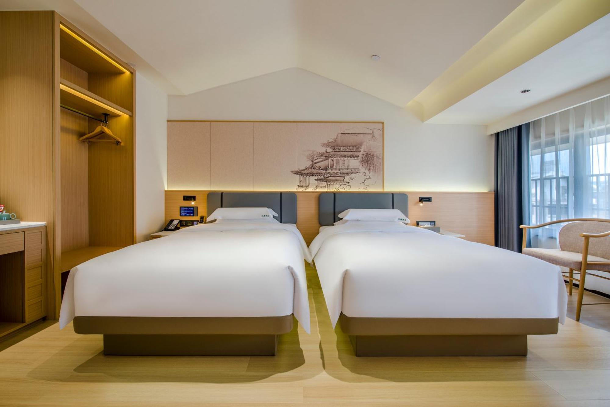 อี้อู๋ ไป่เตอ ธีม โฮเต็ล Hotel อี้วู ภายนอก รูปภาพ